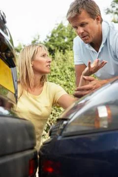 Man And Woman Having Argument After Traffic Accident Stock Photos