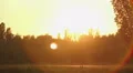 Man and woman having romantic date in beautiful park, walking in sunset rays HD Footage