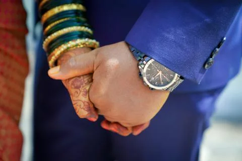 Man and woman holding hands Stock Photos