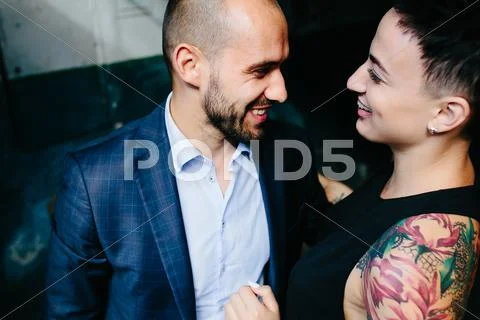 Man and woman hugging in the doorway Stock Photos