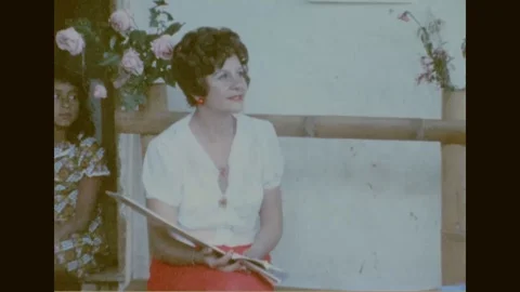 Man and woman interact with the census officer - 1974 Stock Footage 106386028