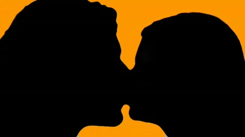 Man and woman kiss orange - HD Stock Footage