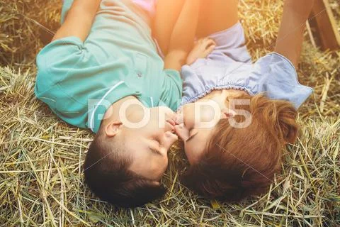 Man and woman lie on hay Stock Photos