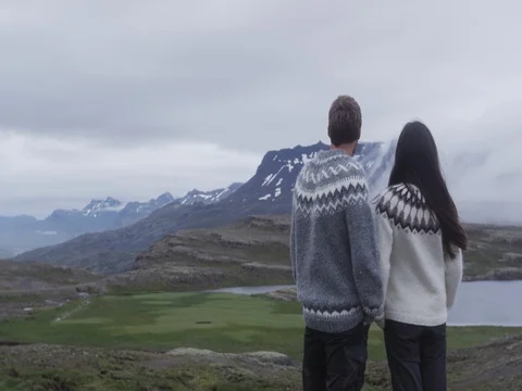 Man and woman looking at view of Iceland nature Stock Footage