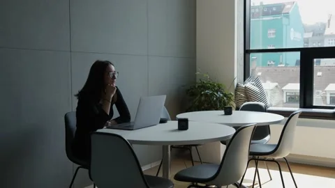 Man and woman making a long distance hiring video call in office Stock Footage 136102201