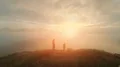 The man and woman meet the sunrise on the mountain top 4k or 4k+ Resolution