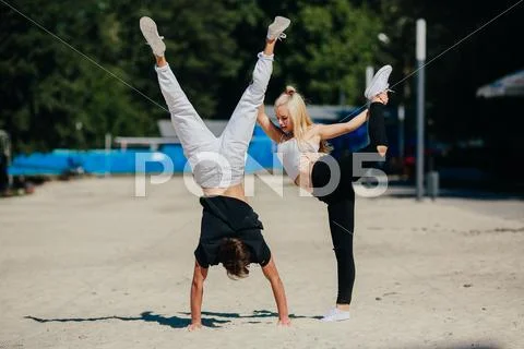 Man and woman performing tricks Stock Photos