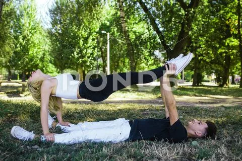 Man and woman performing tricks Stock Photos