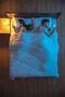 The man and woman phone on the bed. evening night time. view from above Photo