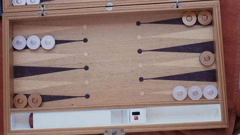 Man and woman playing backgammon and rolling dice.4K top view Video stock 207654640