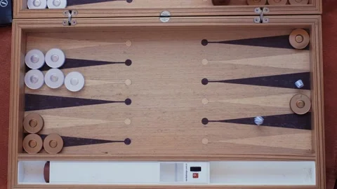 Man and woman playing backgammon and rolling dice.4K Video stock 207654645