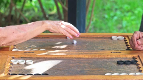 Man and Woman Playing Backgammon Stock Footage 244829161