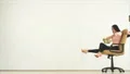 The man and a woman playing with a chair and a money. slow motion 4k or 4k+ Resolution