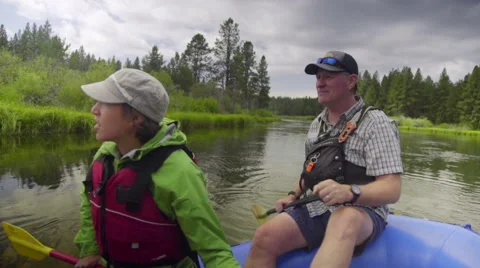 Man and woman on raft Stock Footage 59665734