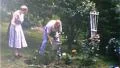 Man and Woman Rose Watering Rose Bushes Garden 1950s Vintage Film Home Movie 206 HD Footage