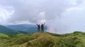 The man and woman with smoke bombs standing on a mountain top 4k or 4k+ Resolution