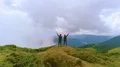 The man and woman with smoke bombs standing on the mountain top 4k or 4k+ Resolution