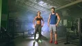The man and woman stand in the fitness center 4k or 4k+ Resolution