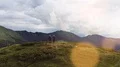 The man and woman standing on the mountain top with a beautiful view 4k or 4k+ Resolution
