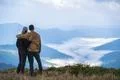 The man and a woman standing on the mountain landscape background Photo