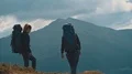 The man and woman standing in the picturesque mountains 4k or 4k+ Resolution