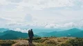 The man and woman standing on the picturesque mountain 4k or 4k+ Resolution
