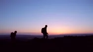 Man And Woman Standing On Top Of Mountain, Looking At View Stock Footage