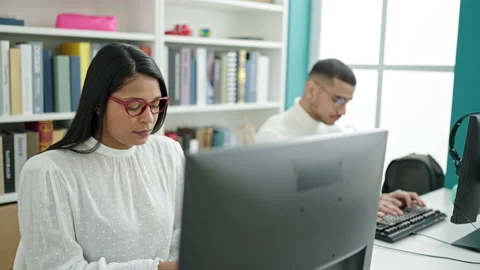 Man and woman students using computer studying at university classroom 스톡 동영상 237281459