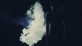 The man and woman walking in the dark through a smoke cloud. slow motion 4k or 4k+ Resolution