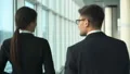 The man and a woman walking near windows. slow motion HD Footage