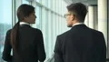 The man and a woman walking near windows. slow motion 4k or 4k+ Resolution