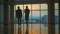 The man and a woman walking in the office hall. slow motion HD Footage
