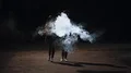 The man and woman walking in a smoke cloud. night time, slow motion 4k or 4k+ Resolution
