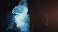 The man and woman walking through the blue smoke. slow motion 4k or 4k+ Resolution