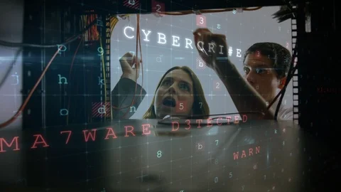 Man and woman working in computer server room while a glowing circuit board Video stock 112906361