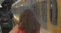 Man and women boarding a train in Sao Bento train station in Porto 4k or 4k+ Resolution