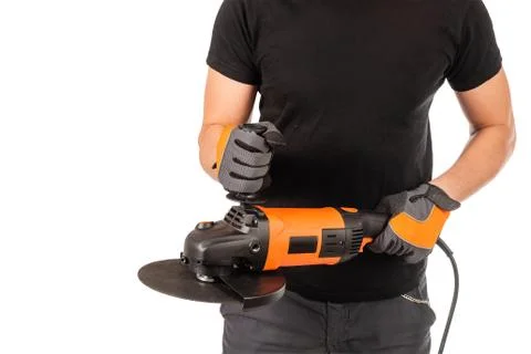 Man with angle grinder on white background. Photos