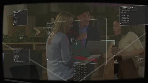 Man angling laptop and explaining code, team viewing phone, HUD flagging Stock Footage 333594924