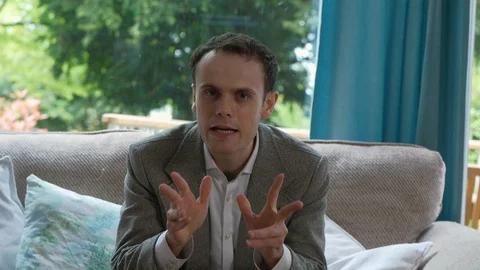 Man Angrily talking to camera about business matters remote firing Stock Footage 89922711