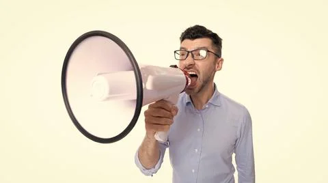 Man announcing with anger in megaphone at studio. shouting man announcing with Foto stock