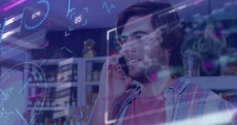 Man answering incoming call while monitoring holographic retail UI showing Stock Footage 328396645