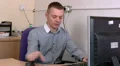 Man answers his mobile phone at work HD Footage