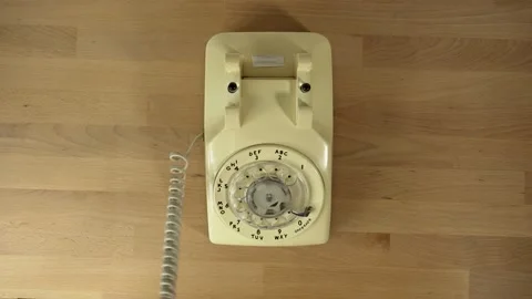 A man answers then slams down a vintage telephone in frustration Stock Footage 201747664