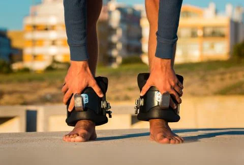 Man in anti gravity, inversion boots, upside down hanging on the horizontal bar Stock Photos