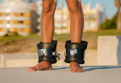 Man in anti gravity or inversion boots for upside down hanging. Sports equipment Stock Photos