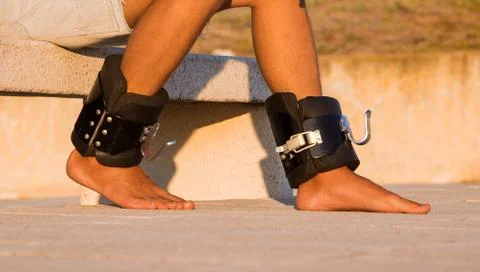 Man in anti gravity or inversion boots. Sports equipment. Stock Photos