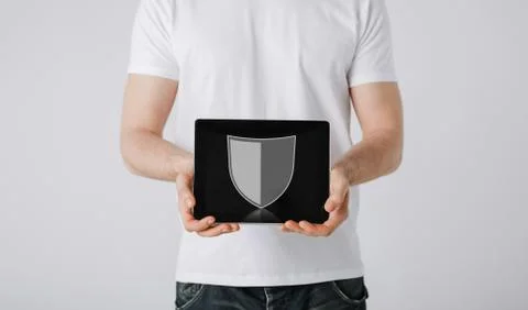 Man with antivirus program icon on tablet pc Stock Photos
