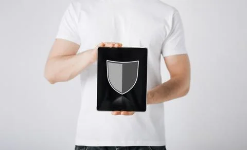 Man with antivirus program icon on tablet pc Stock Photos