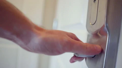 Man in apartment opening door to empty hallway Stock Footage 136990979