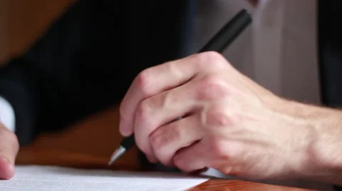 Man appending signature on documents Stock Footage 63455077